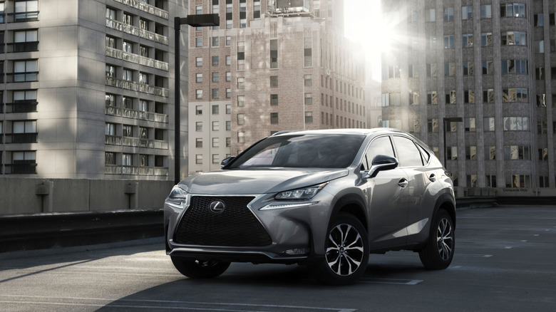 2015 Lexus NX 200t on a park lot with skyscrapers in the background