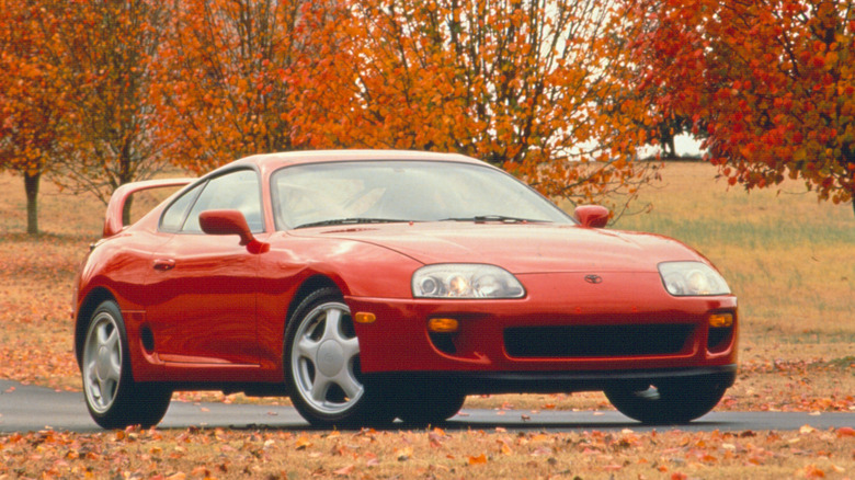 Red Toyota Supra MK IV front 3/4 during fall