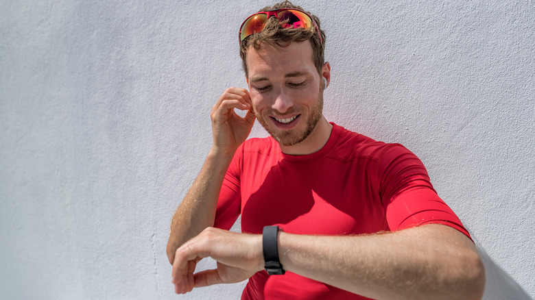 Man listening to music from Fitbit