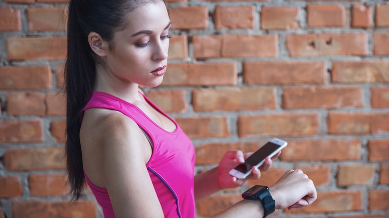 Woman communicating with Fitbit