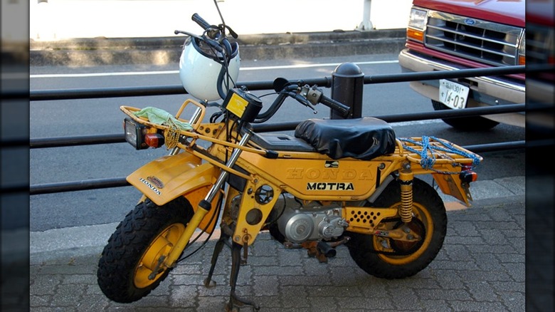 honda ct50 motra minibike motorcycle parked sidewalk