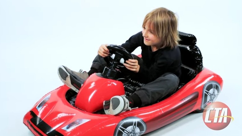 Child using Wii inflatable kart