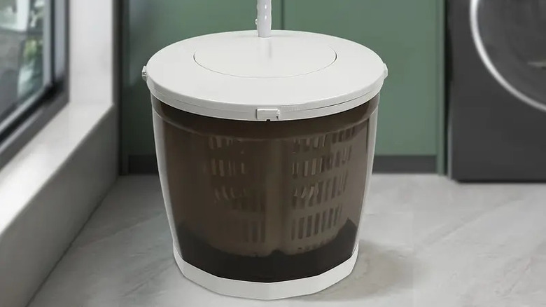 Mini portable washing machine on floor