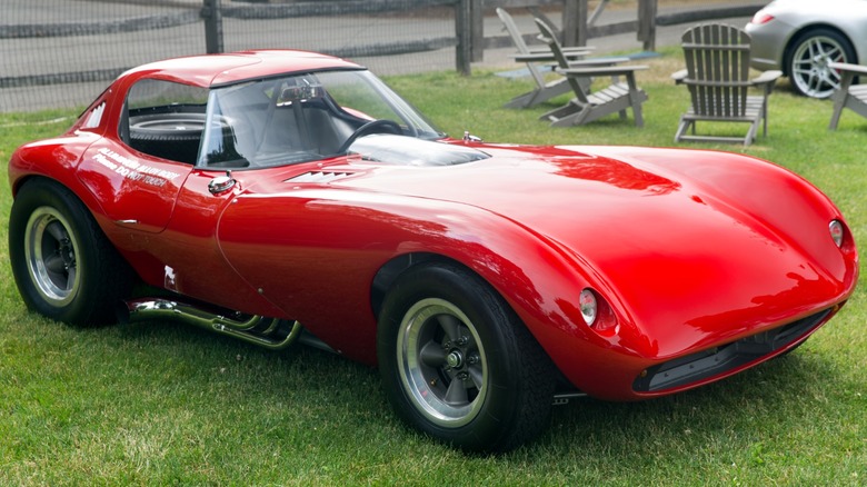 Red Bill Thomas Cheetah parked on grass