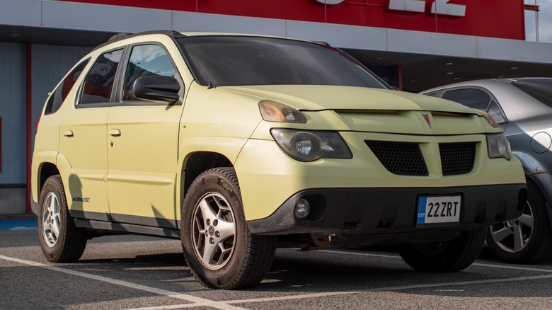 Tan Pontiac Aztek in parking lot