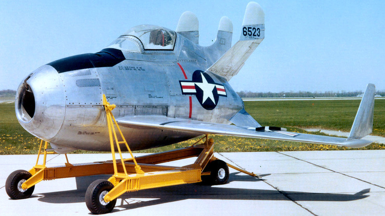 XF-85 Goblin on cart in front of field