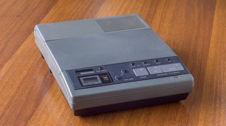 vintage cassette answering machine on wood background