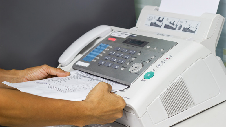 feeding document into an old fax machine