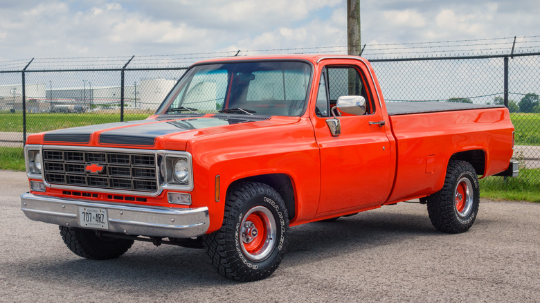 The Chevrolet C/K Action Line in orange, front 3/4 view