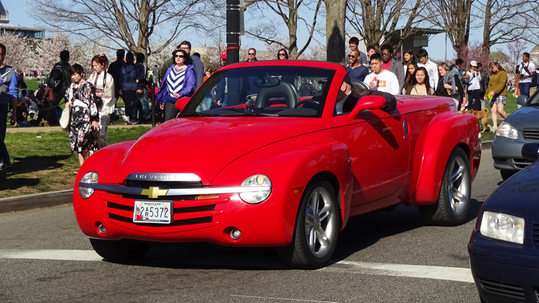 The Chevrolet SSR in red driving, top down, front 3/4 view