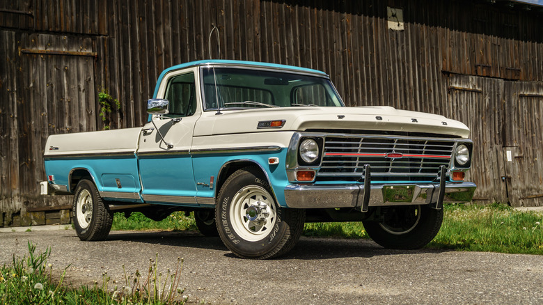 The Ford F-100 in two-tone blue and white, front 3/4 view