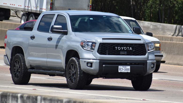 A gray second generation Toyota Tundra on the highway, front 3/4 view