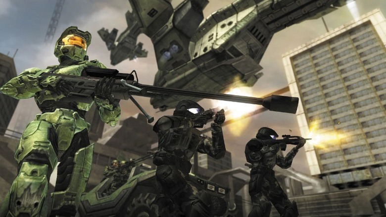 Master Chief holding a sniper rifle with other marines