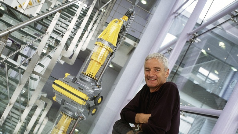 James Dyson with vacuum cleaner