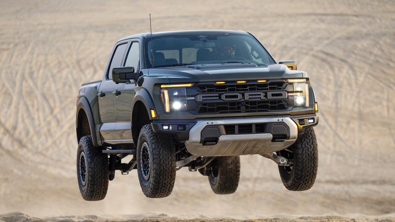 The 2024 F-150 Raptor catching some air, front 3/4 view