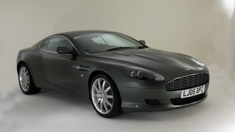 The Aston Martin DB9 in dark green, front 3/4 view