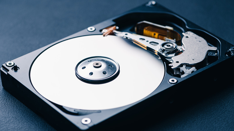 A hard drive opened up to expose the disc