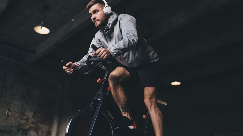 A man using an exercise bike