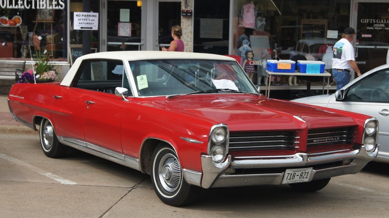 Red 1964 Pontiac Bonneville parked at roadside