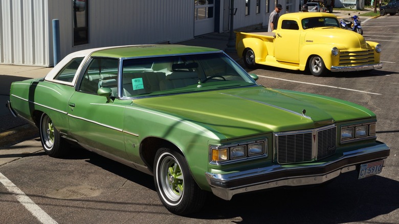 Green 1976 Pontiac Bonneville parked