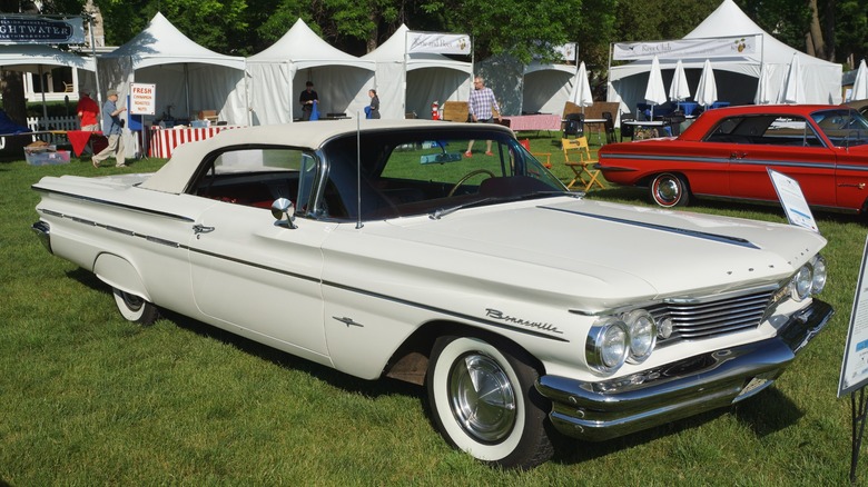 White 1960 Pontiac Bonneville Convertible parked on grass