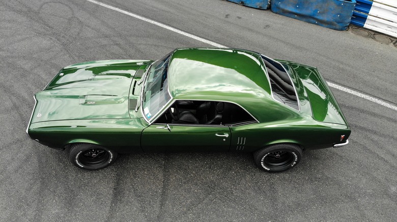 Green 1968 Pontiac Firebird on roadway