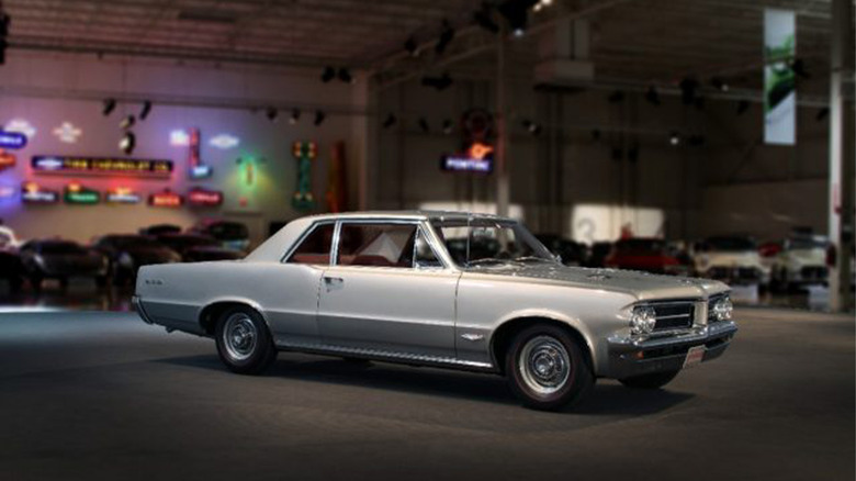 A Pontiac GTO in a decked out garage