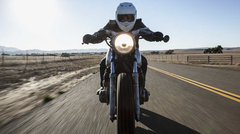 Person riding a motorcycle on a highway