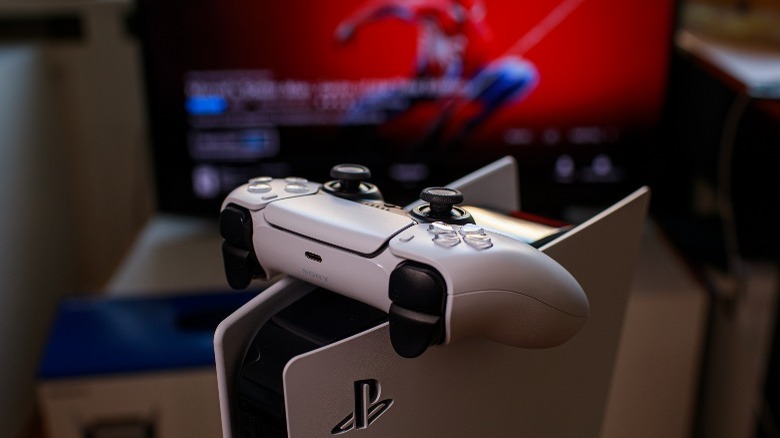 A DualSense controller on top of a PS5