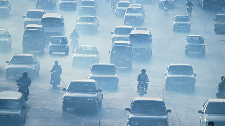 Air pollution and dust on busy highway with traffic