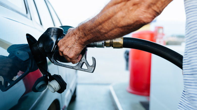 Man filling up car with gasoline