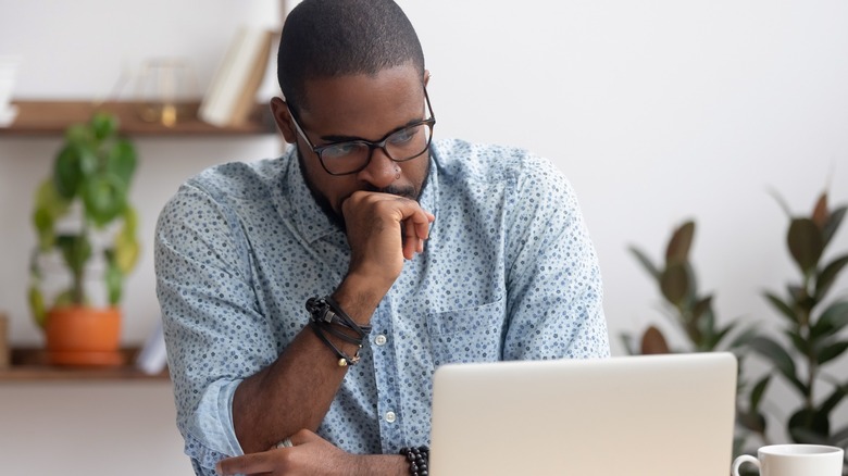 Man staring at a laptop