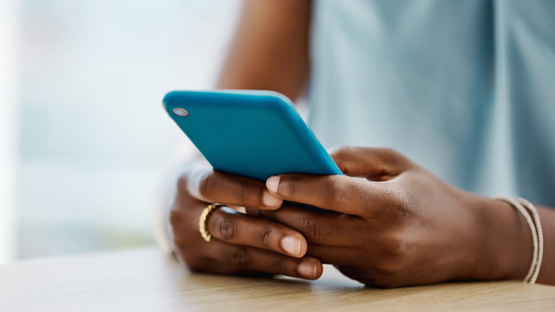 Woman using a smartphone in an office