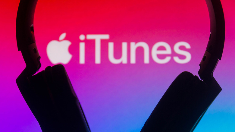 iTunes logo with headphones in foreground