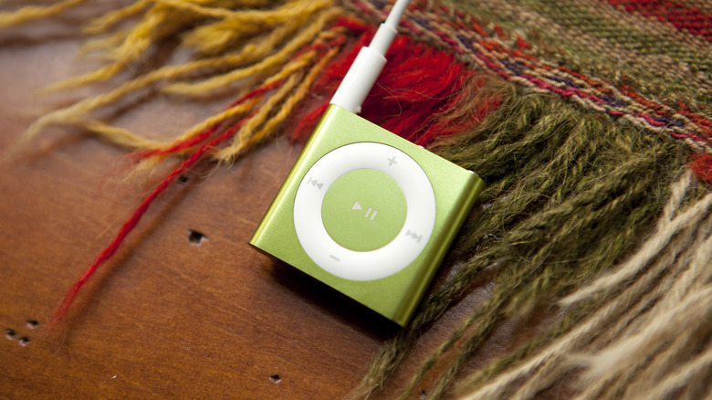 green iPod Shuffle on carpet