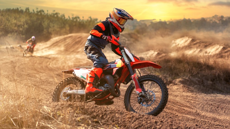 Rider operating dirt bike