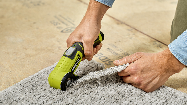 Ryobi power cutter cutting carpet