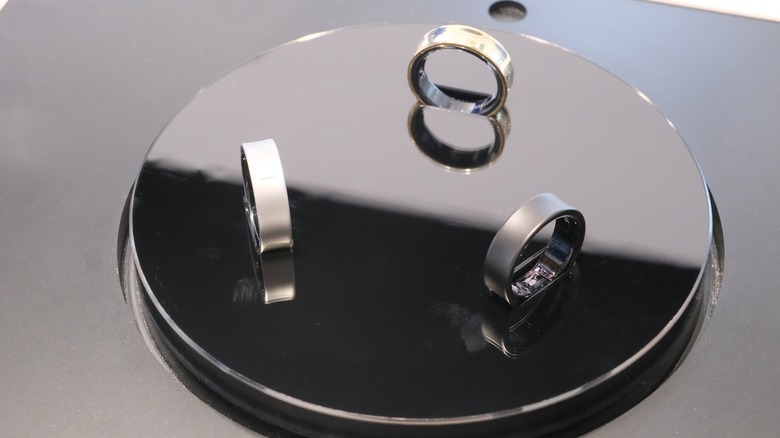 Three Samsung Galaxy Rings on a display stand