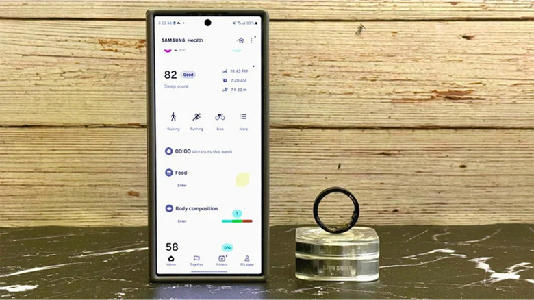 A Samsung Galaxy Ring next to a Samsung smartphone