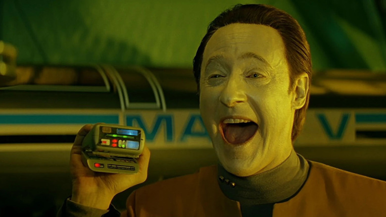 Data plays with a tricorder