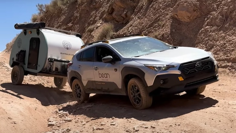 Subaru Crostrek pulling a Bean trailer off-road