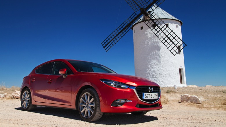 Mazda3 by a windmill