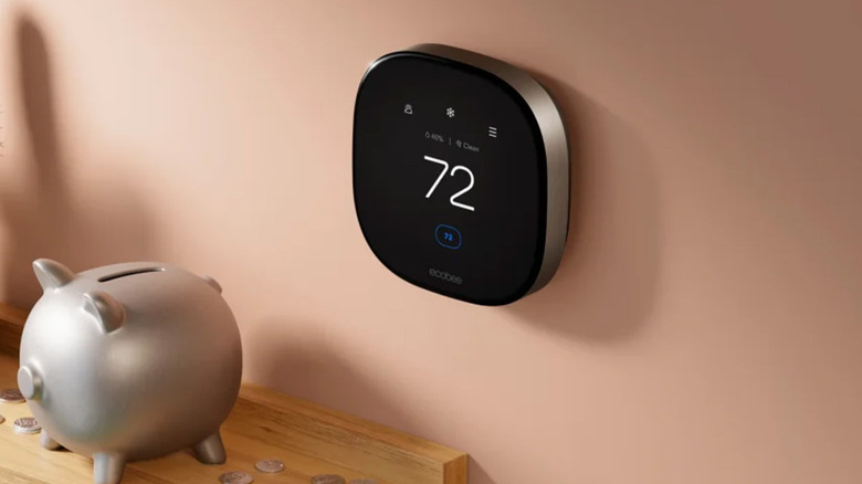 An Ecobee Thermostat Premium on a pink wall