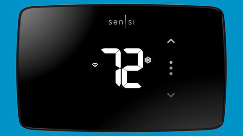 A Sensi Lite Smart Thermostat on a blue background