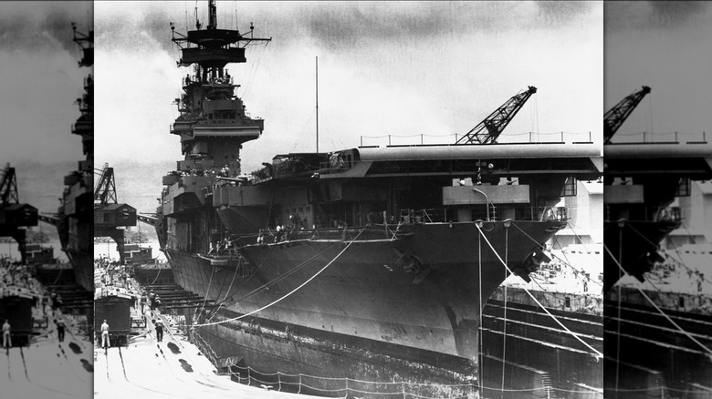 The aircraft carrier USS Yorktown is in dry dock at Pearl Harbor, being readied for the Battle of Midway. June 1942.