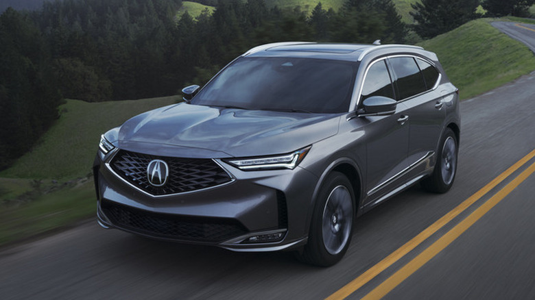 Grey Acura MDX at speed