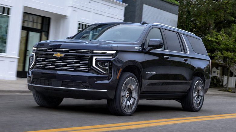 Black Chevrolet Suburban at speed