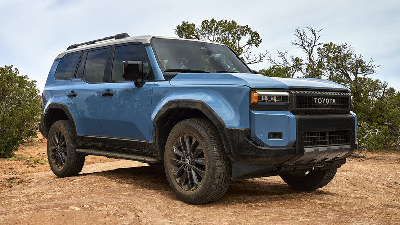 Blue Toyota Land Cruiser parked off-road