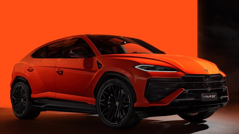 Orange Lamborghini Urus SE in front of orange background