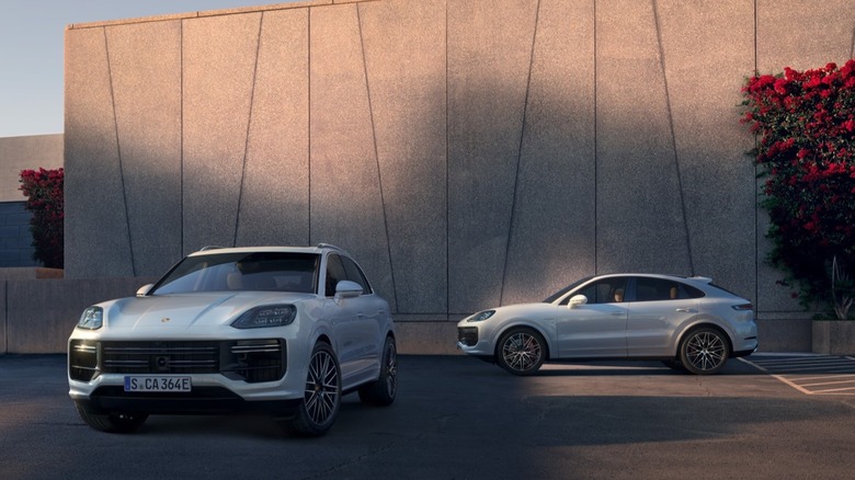 Porsche Cayenne Turbo E-Hybrid SUV and Coupe parked in front of a building